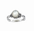Bague artisanale en argent sterling avec cabochon de nacre naturelle, design bohème avec détails floraux et finition oxydée vintage