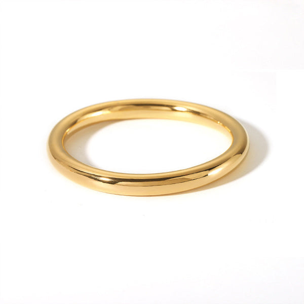 Bracelet bangle rigide doré au fini brillant et épuré. Un bijou intemporel et élégant pour femme, signé Alberto Bijoux.