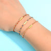 Bracelet perlé pour femme avec pendentif plume dorée, au style bohème chic et coloré – Alberto Bijoux