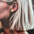 Paire de boucles d’oreilles ovales dorées 10mm en acier inoxydable, finition brillante.