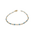 Bracelet chaîne gourmette en acier doré avec perles bleues électriques et fermoir mousqueton sur fond blanc