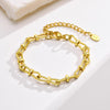 Bracelet doré pour femme avec chaîne torsadée et nœud central, au style chic et intemporel – Alberto Bijoux