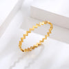 Bracelet bangle doré rigide pour femme avec découpe en forme d’éclair, au style moderne et audacieux – Alberto Bijoux