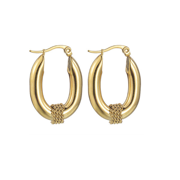Boucles d’oreilles dorées ovales à double afond clairnneau avec tressage central.