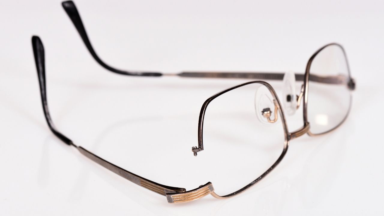 Broken glasses on white background