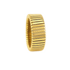 Bague dorée extensible à surface rainurée posée sur fond clair