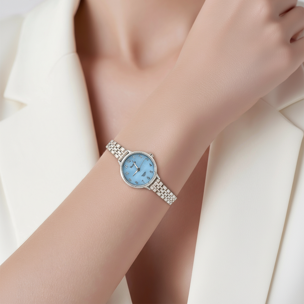 Montre femme tout acier 28mm cadran bleu ciel chiffres arabes bracelet jubilé argenté