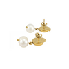 i Boucles spirale dorées avec perle blanche, vues couchées avec fermoir papillon