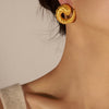 Paire de boucles d’oreilles dorées spiralées 30x13mm en acier inoxydable, finition brillante.