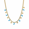 Collier doré avec pendentifs lunes turquoise et étoiles dorées, présenté sur un coussin beige - Alberto bijoux