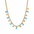 Collier doré avec pendentifs lunes turquoise et étoiles dorées, présenté sur un coussin beige - Alberto bijoux