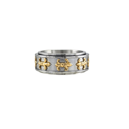 Two-tone stainless steel fleur-de-lis spinner ring with gold accents