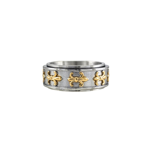 Two-tone stainless steel fleur-de-lis spinner ring with gold accents