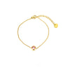 Bracelet doré fin avec pierre ronde rose au centre et chaîne ajustable